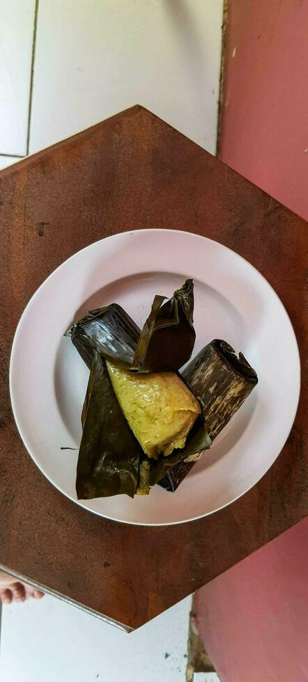 Arem-arem is a typical Central Javanese food in the form of rice containing tempeh sauce or meat fried chili sauce photo