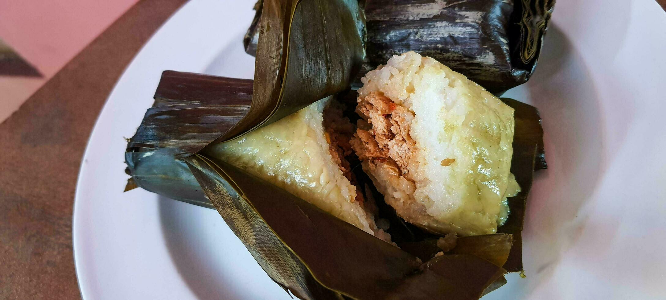 Arem-arem is a typical Central Javanese food in the form of rice containing tempeh sauce or meat fried chili sauce photo