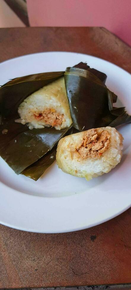 Arem-arem is a typical Central Javanese food in the form of rice containing tempeh sauce or meat fried chili sauce photo