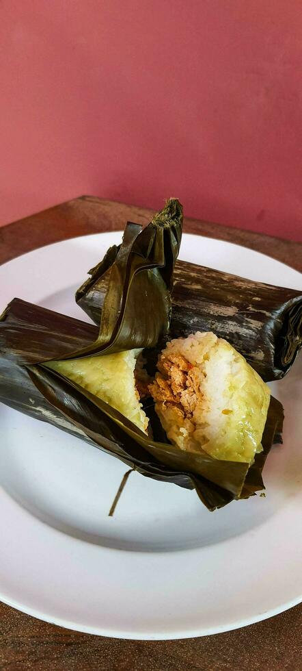 Arem-arem is a typical Central Javanese food in the form of rice containing tempeh sauce or meat fried chili sauce photo