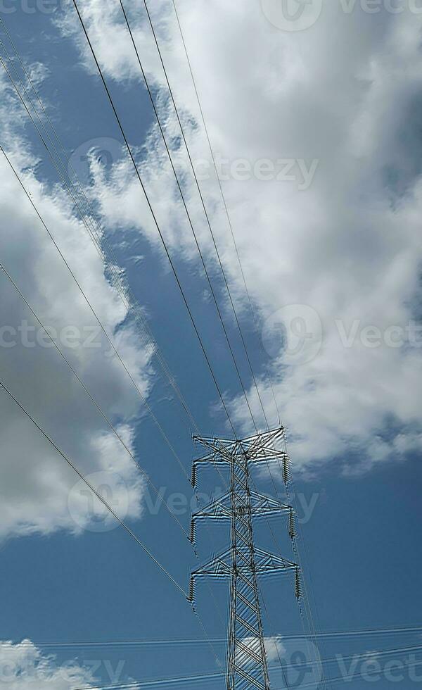 communication tower, electrical tower, power grip, telecommunication tower, mobile phone relay tower, with cables and other technological background photo
