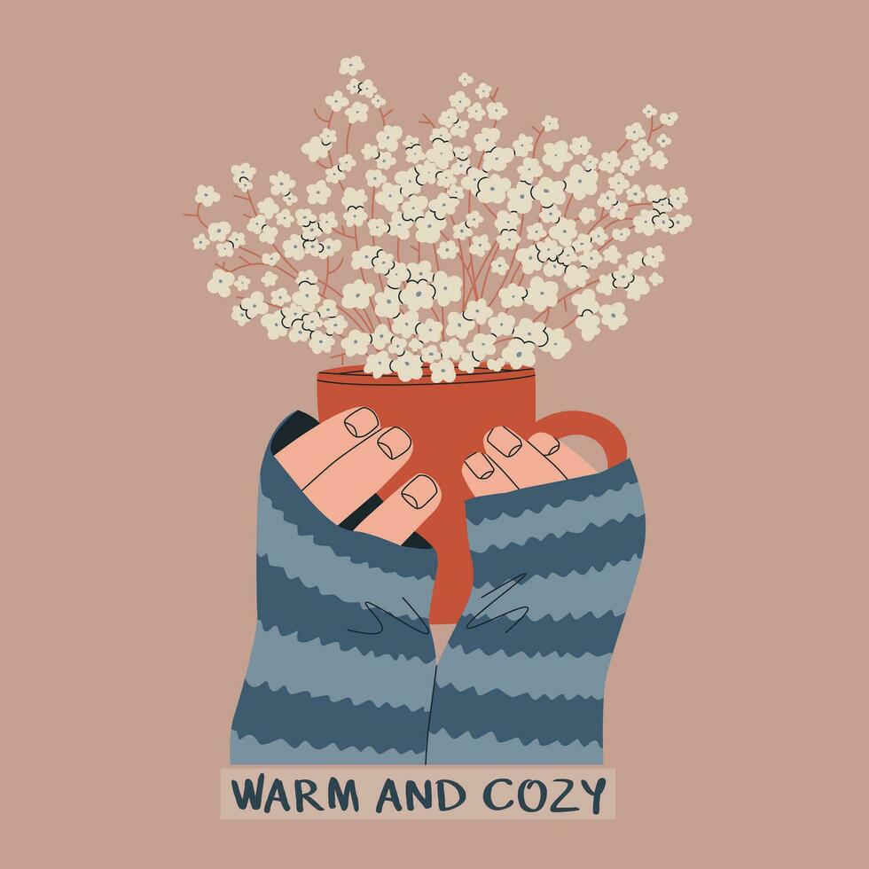 Hands hold a mug with small flowers inside. Text - warm and cozy. Vector illustration for autumn design, postcard, sticker, etc.