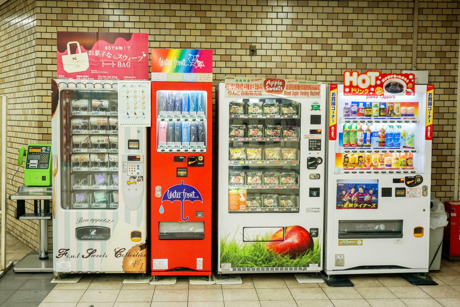 Osaka, Japan, 2018 - Vending machine in Japan not only sell beverages and cigarettes, it also sells a wide variety product such as small sized bags, small umbrellas, lunch box or slice fruit. photo