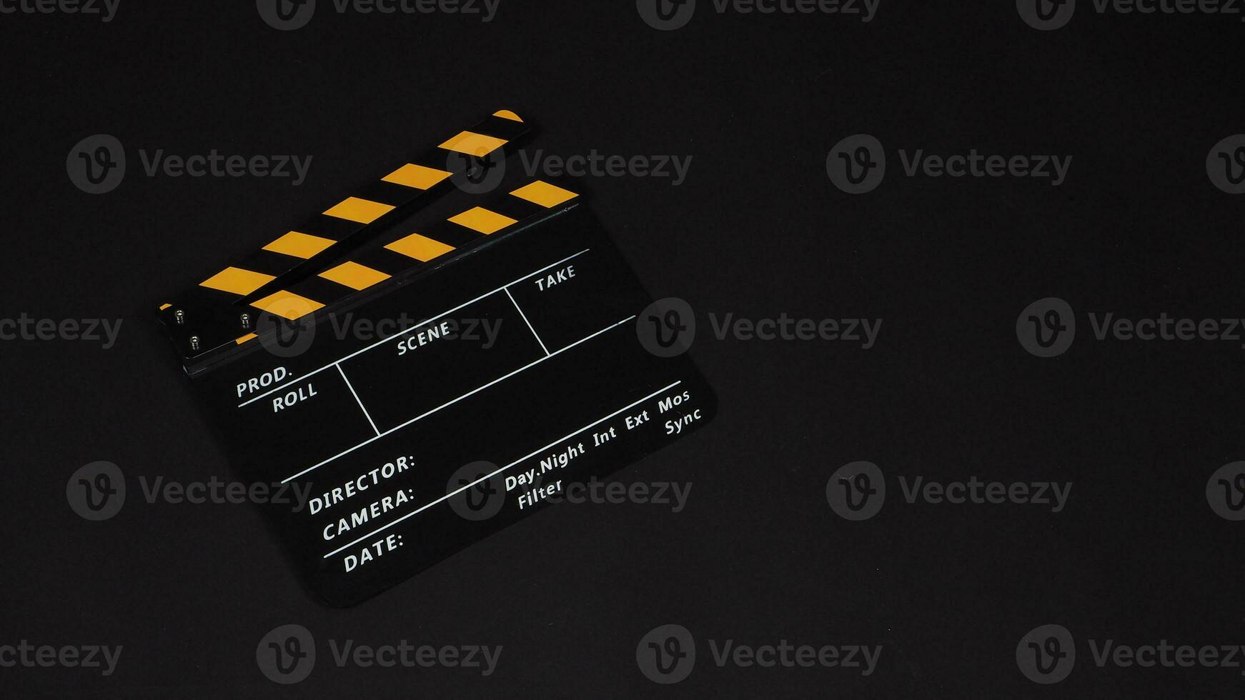 Clapperboard or movie slate on black background.it use in video production and film industry . photo