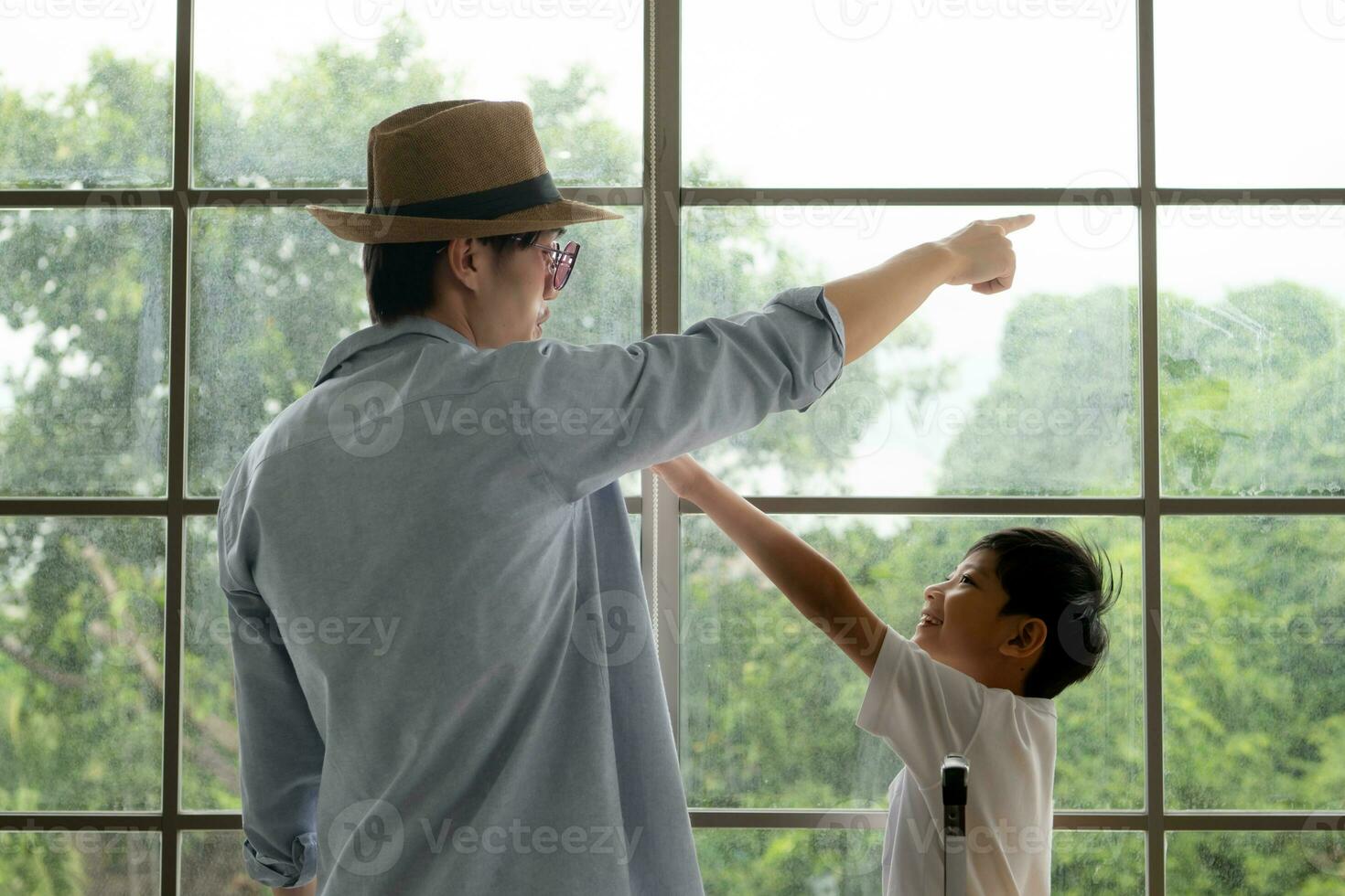 Father and son are happy and ready to travel on a weekend trip photo