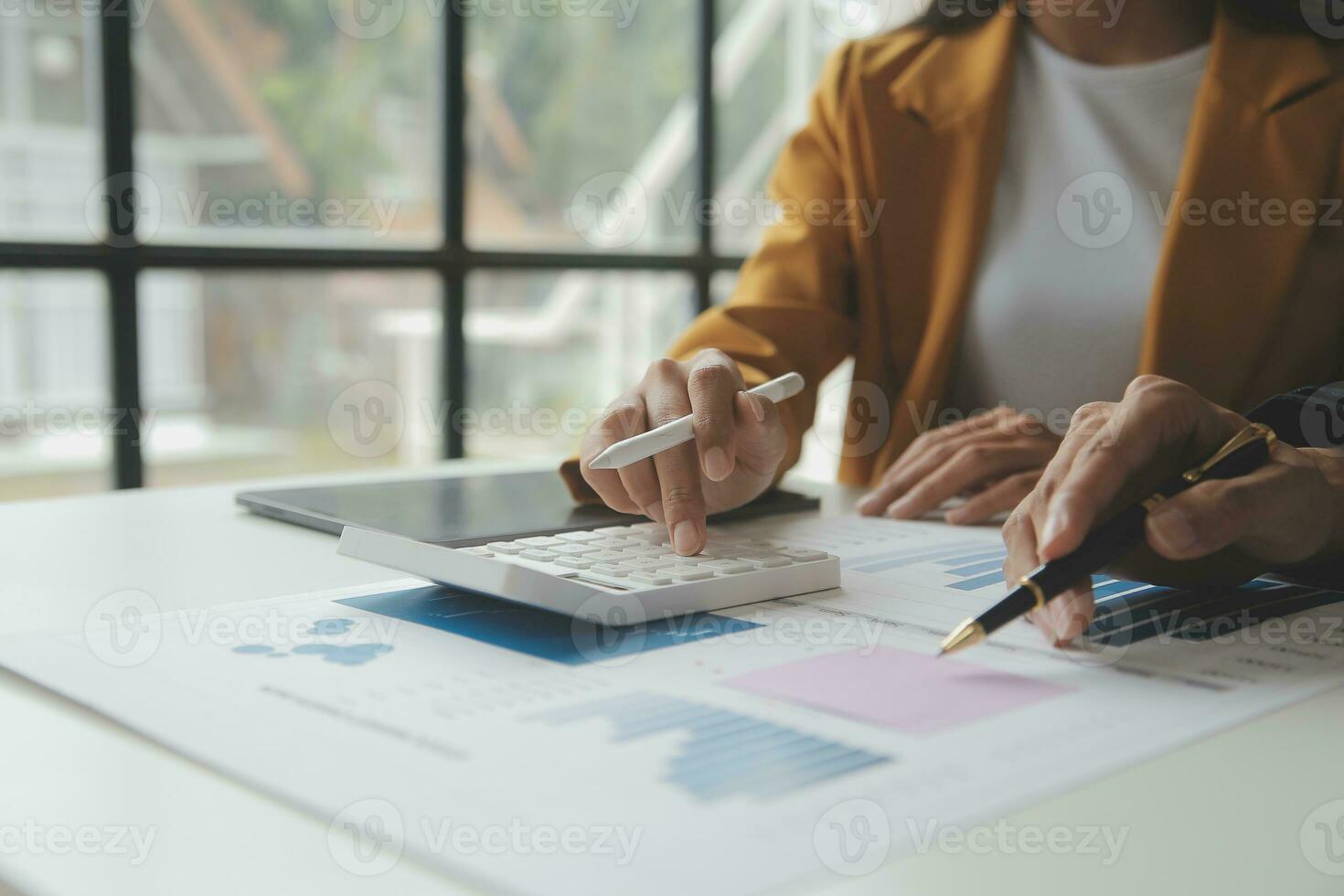 Accounting businessman working on laptop computer and analyzing real estate investment data, Financial and tax systems concept. photo