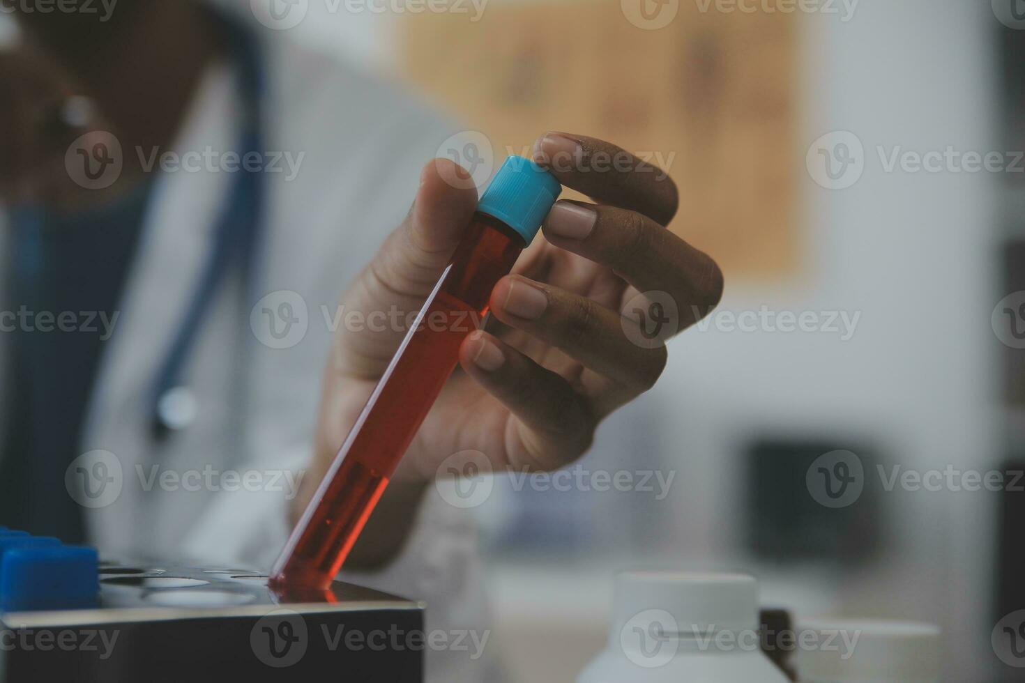 Professional lab. Amazing longhaired medical worker wearing uniform while using microscope during research photo
