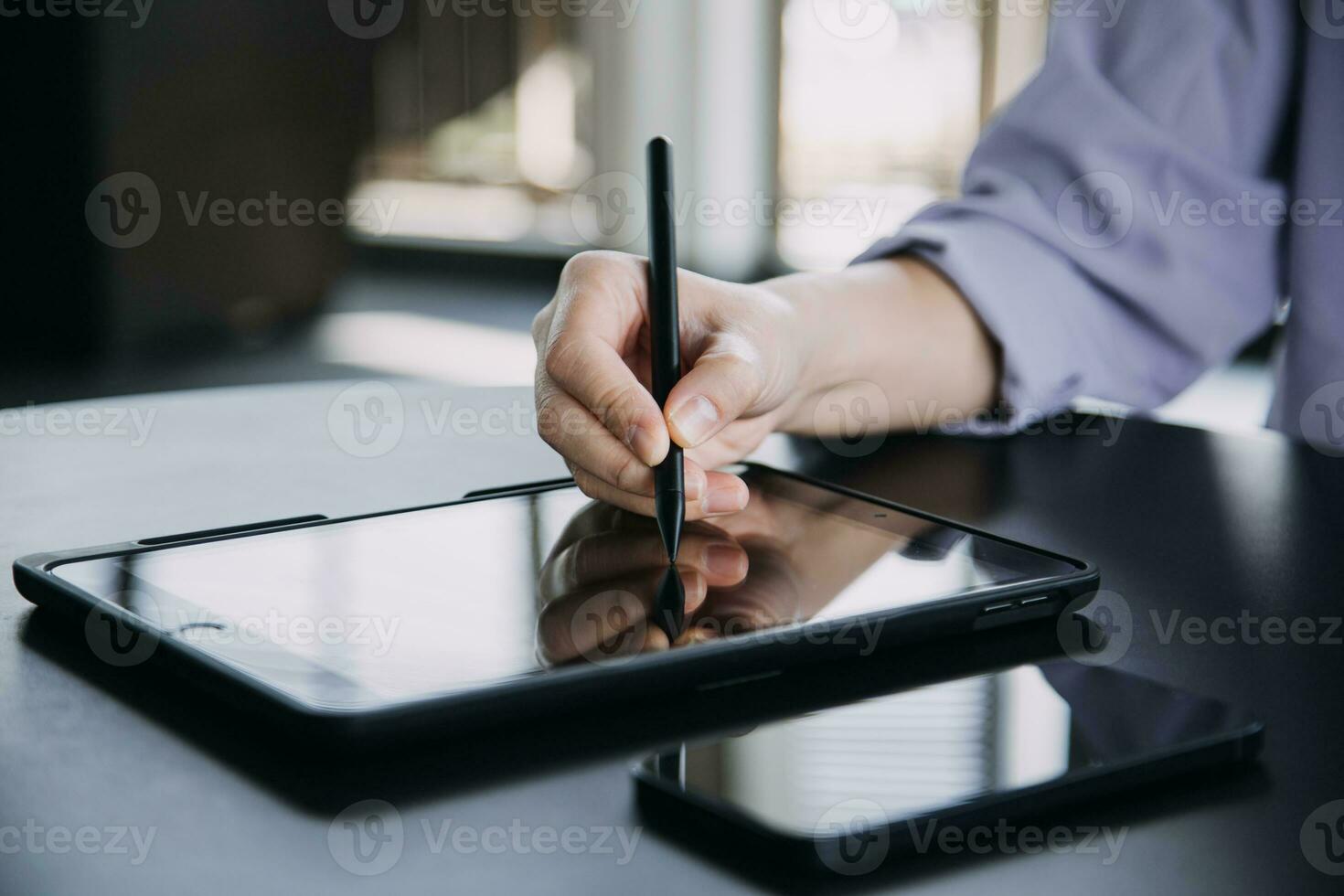 Asian Business woman using calculator and laptop for doing math finance on an office desk, tax, report, accounting, statistics, and analytical research concept photo