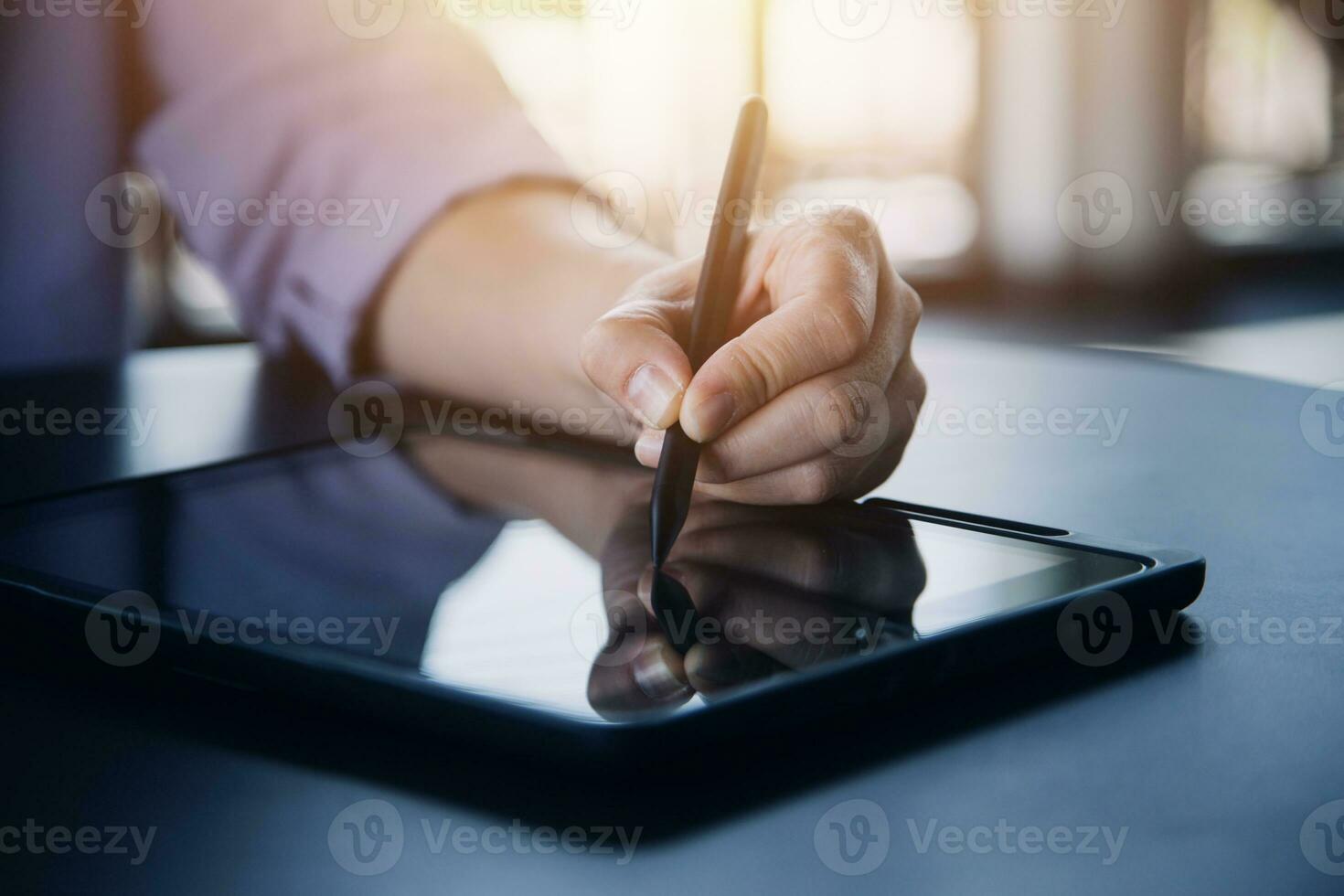 Asian Business woman using calculator and laptop for doing math finance on an office desk, tax, report, accounting, statistics, and analytical research concept photo