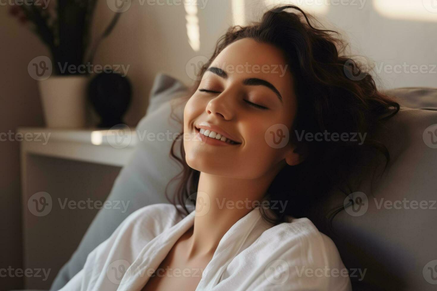 A woman embracing her reflection in the mirror admiring her newfound beauty after reconstructive surgery empty space for text photo