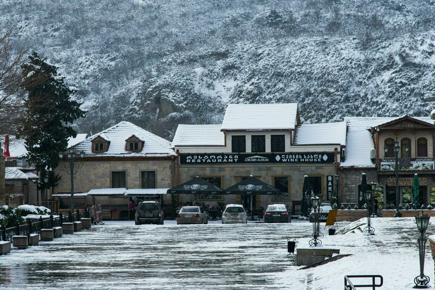 Mtskheta, Georgia - JANUARY 13, 2023 Walk along the street in small town winter season photo