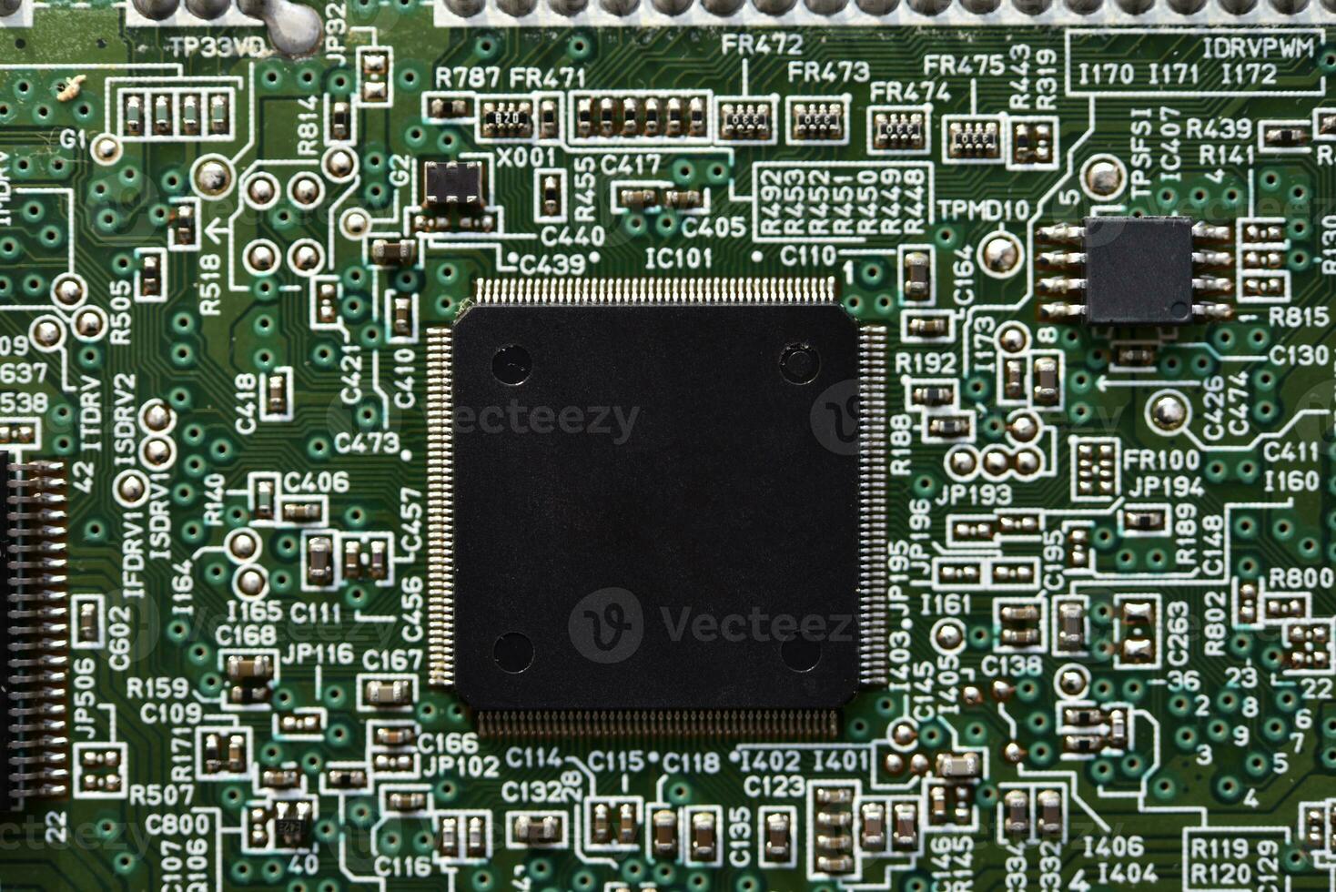 Blue board with radio elements. A chip with a processor and transistors. Diodes and resistors. Microchip. photo