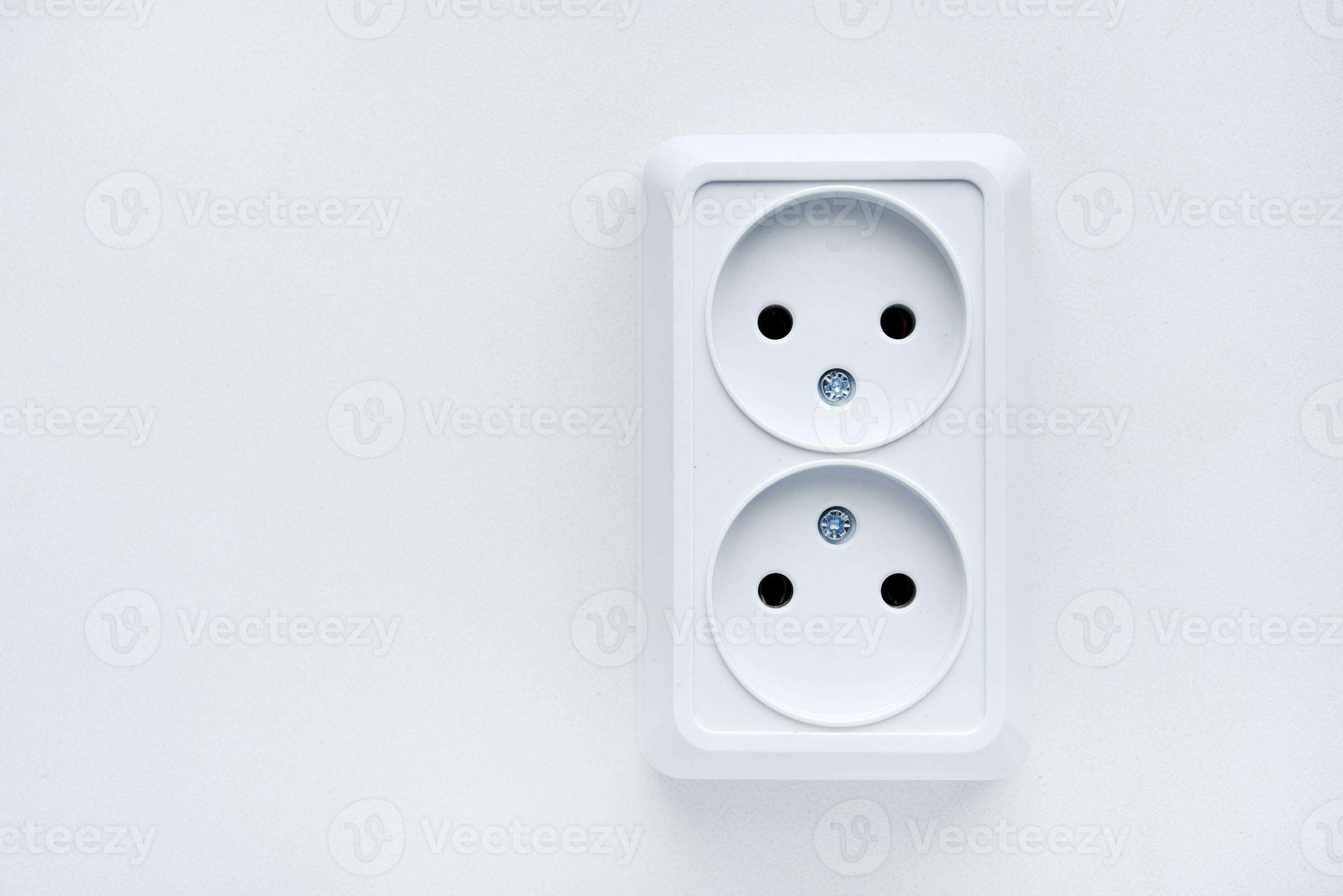 White double electrical outlet on a white background. Eurozette closeup. Electrical appliance