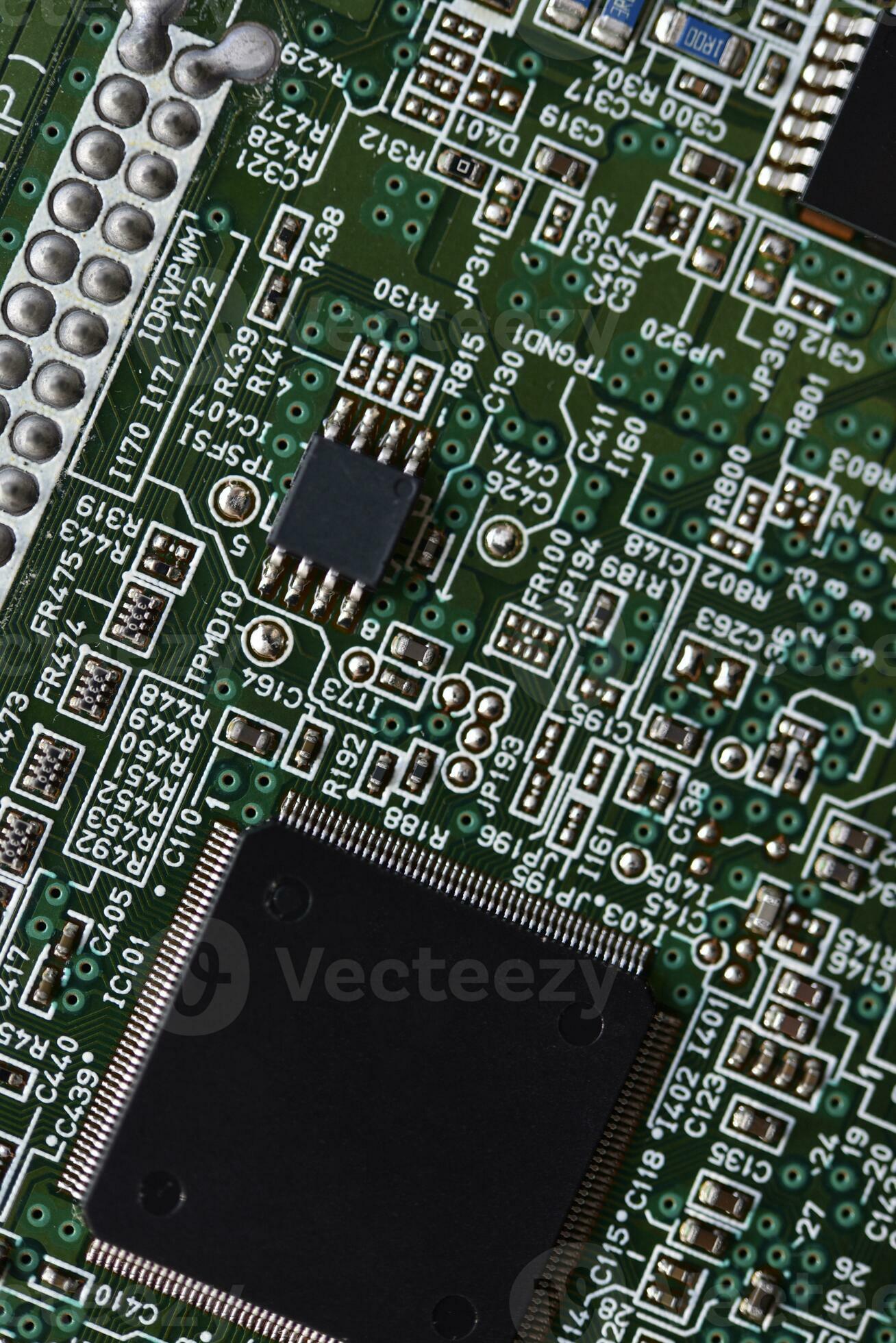 Blue board with radio elements. A chip with a processor and transistors. Diodes and resistors