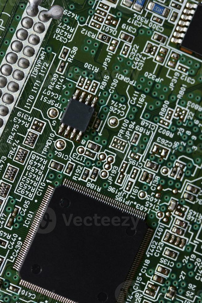 Blue board with radio elements. A chip with a processor and transistors. Diodes and resistors. Microchip. photo