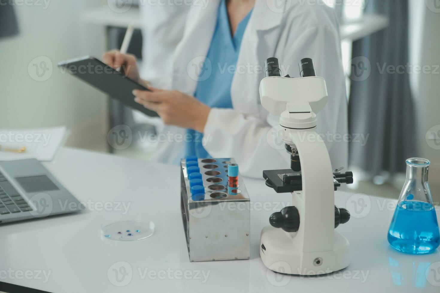 Team of Scientists Choose Between Printed Circuit Board to Work With. In The Background Technologically Advanced Scientific Research Center. photo