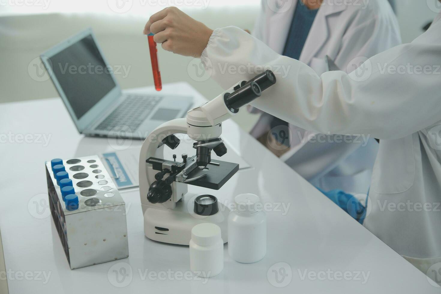 Team of Scientists Choose Between Printed Circuit Board to Work With. In The Background Technologically Advanced Scientific Research Center. photo
