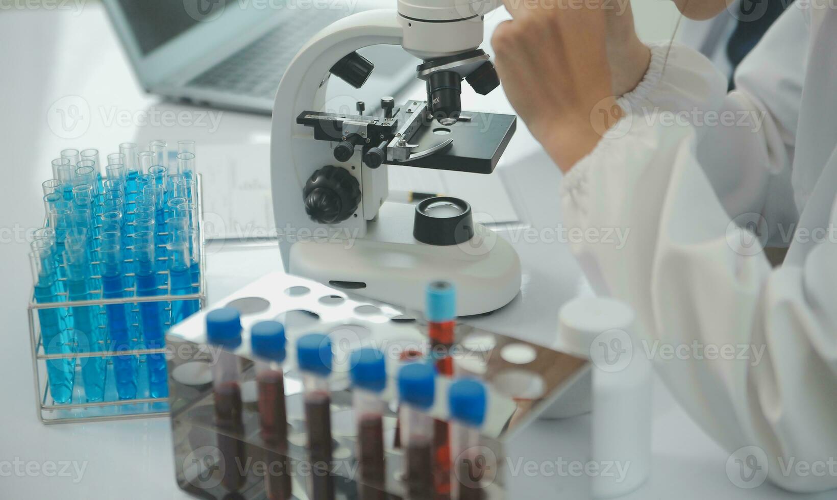 Team of Scientists Choose Between Printed Circuit Board to Work With. In The Background Technologically Advanced Scientific Research Center. photo