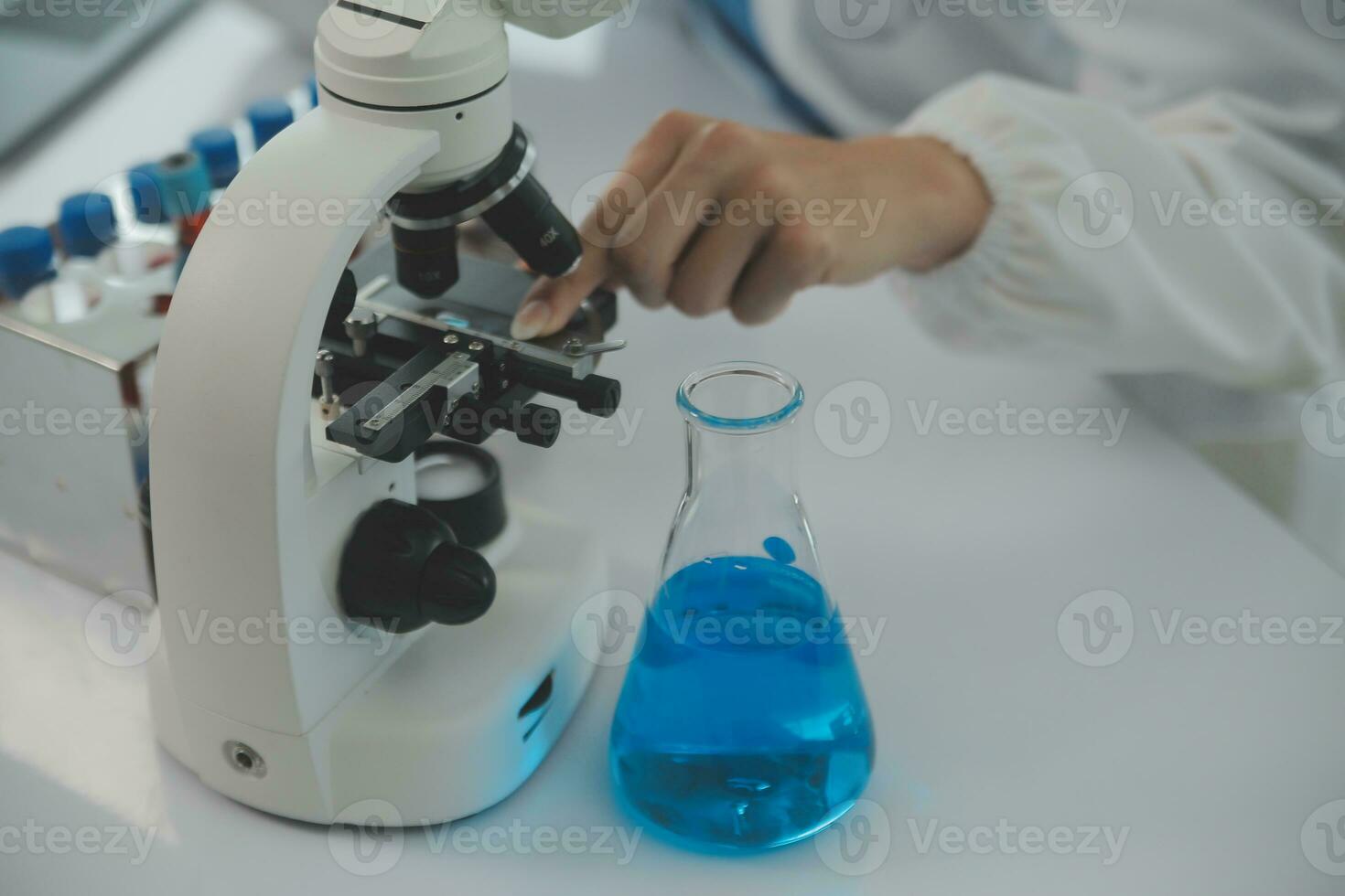 Team of Scientists Choose Between Printed Circuit Board to Work With. In The Background Technologically Advanced Scientific Research Center. photo