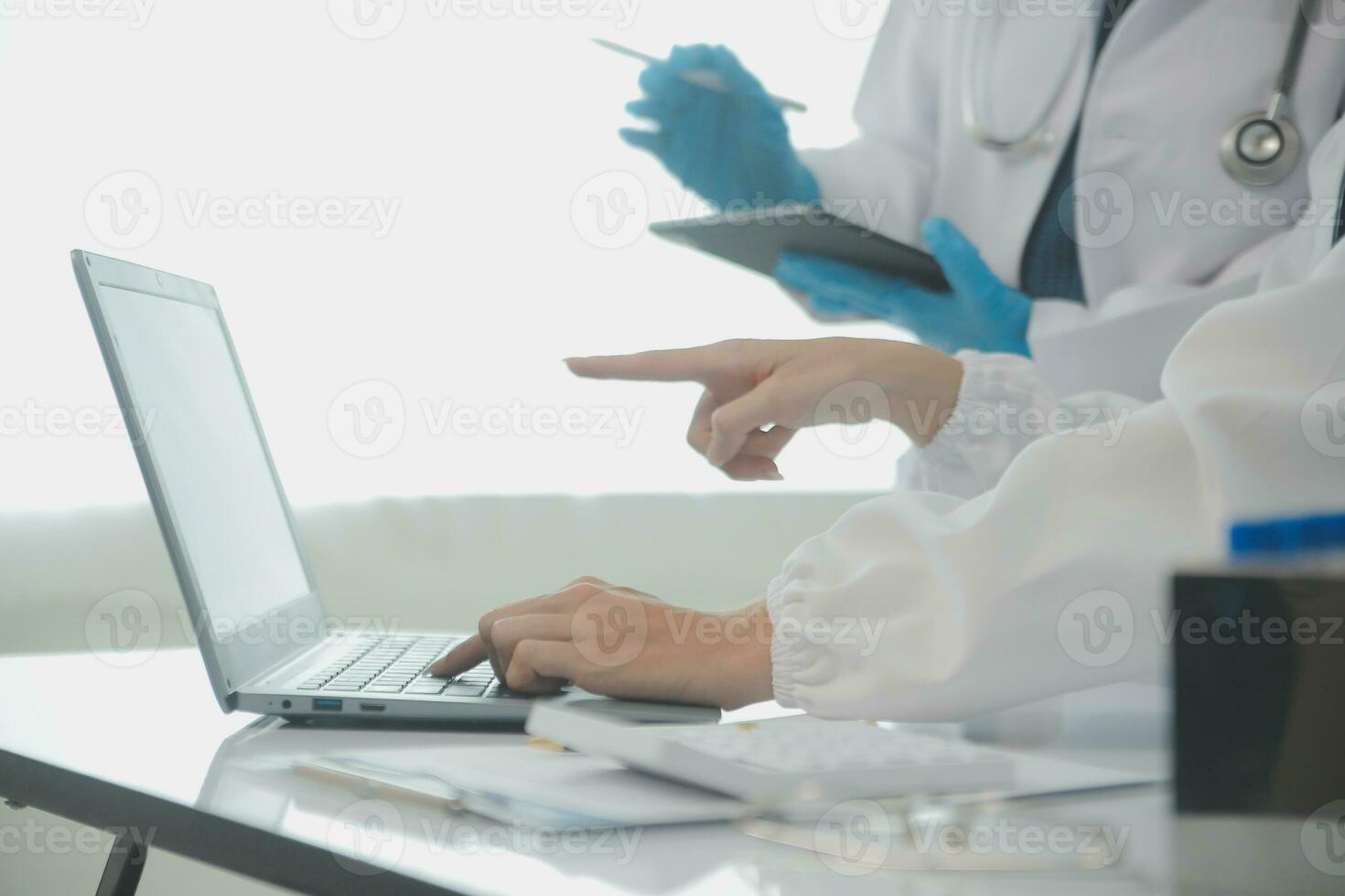 Team of Scientists Choose Between Printed Circuit Board to Work With. In The Background Technologically Advanced Scientific Research Center. photo