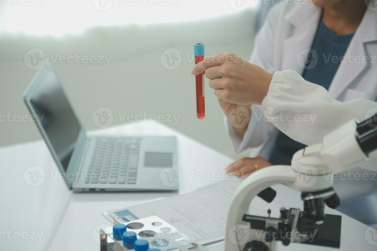 Team of Scientists Choose Between Printed Circuit Board to Work With. In The Background Technologically Advanced Scientific Research Center. photo
