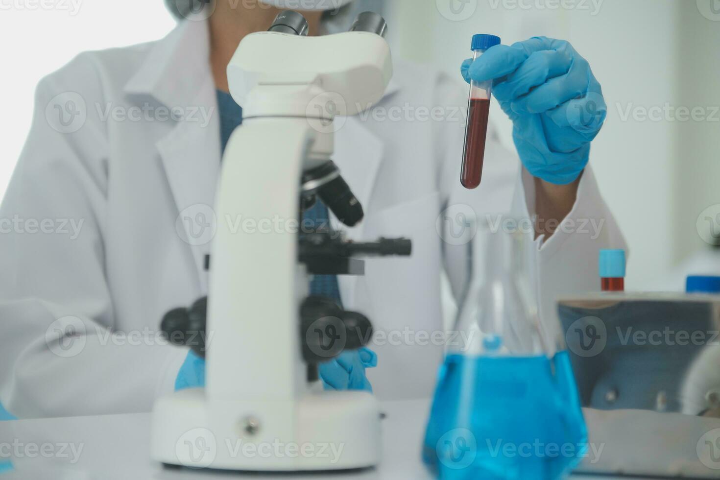 Team of Scientists Choose Between Printed Circuit Board to Work With. In The Background Technologically Advanced Scientific Research Center. photo