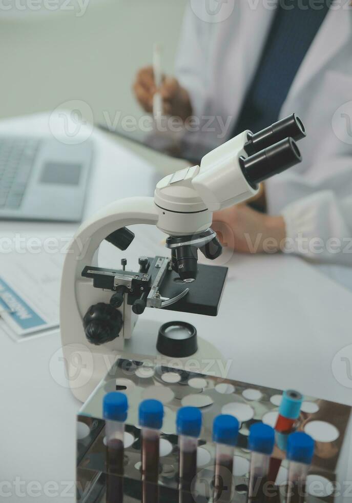 Team of Scientists Choose Between Printed Circuit Board to Work With. In The Background Technologically Advanced Scientific Research Center. photo