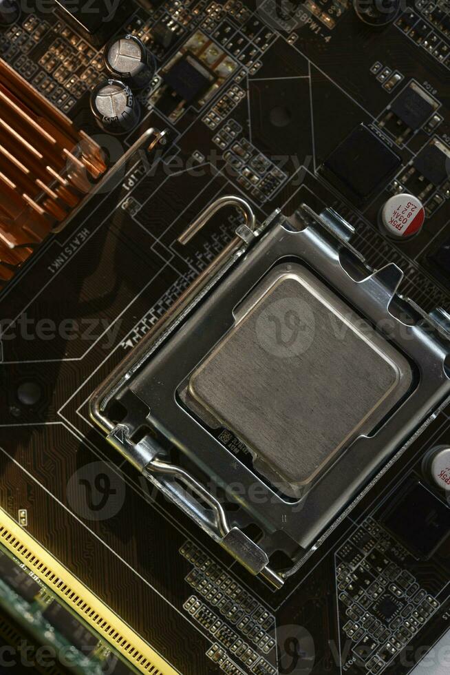 The processor of the computer on the motherboard. Electronic elements and a processor in a computer. photo