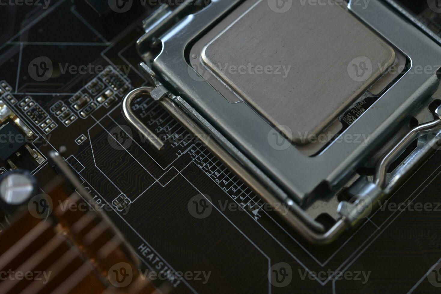 The processor of the computer on the motherboard. Electronic elements and a processor in a computer. photo