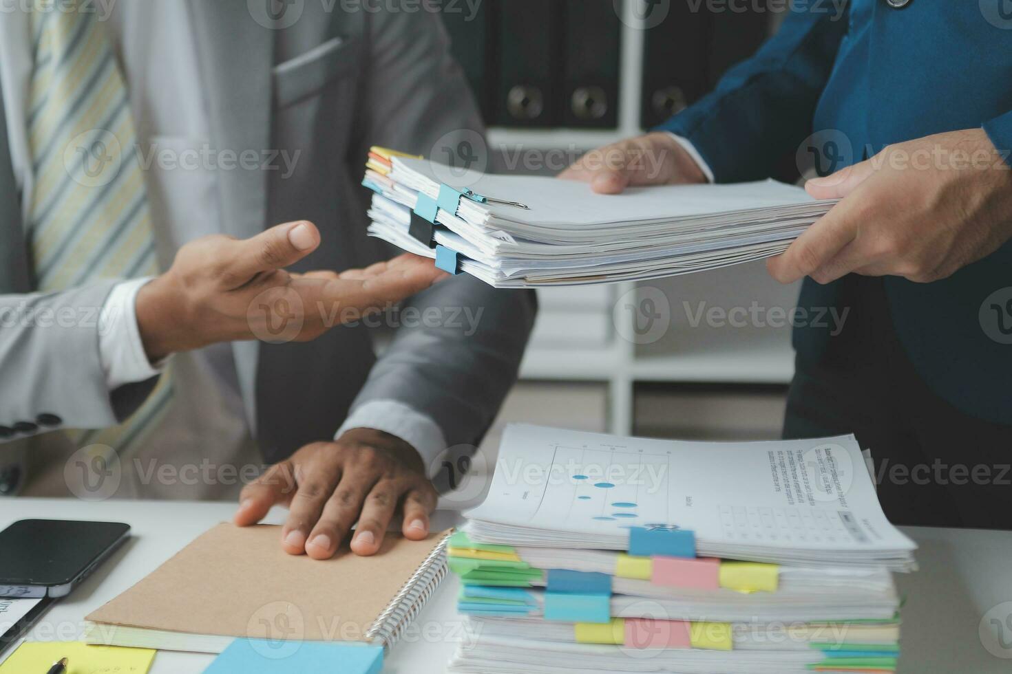 analyst or financial advisor provides advice on securities analysis and stock market management. Businessman showing documents through graphs and charts. Brainstorm and work together photo