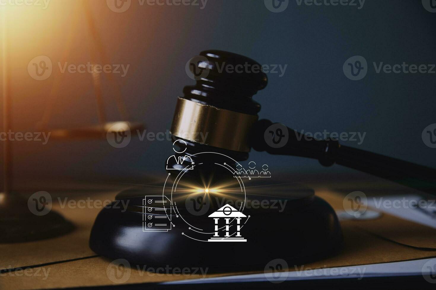 Justice and law concept.Male judge in a courtroom with the gavel, working with, computer and docking keyboard, eyeglasses, on table in morning light photo