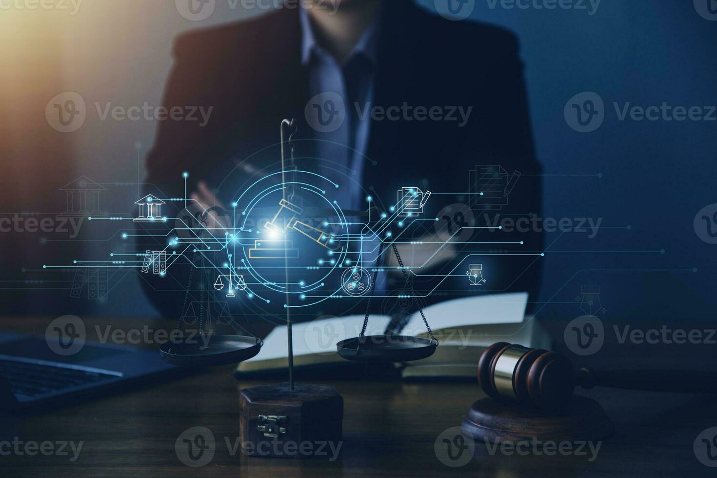 Justice and law concept.Male judge in a courtroom with the gavel, working with, computer and docking keyboard, eyeglasses, on table in morning light photo