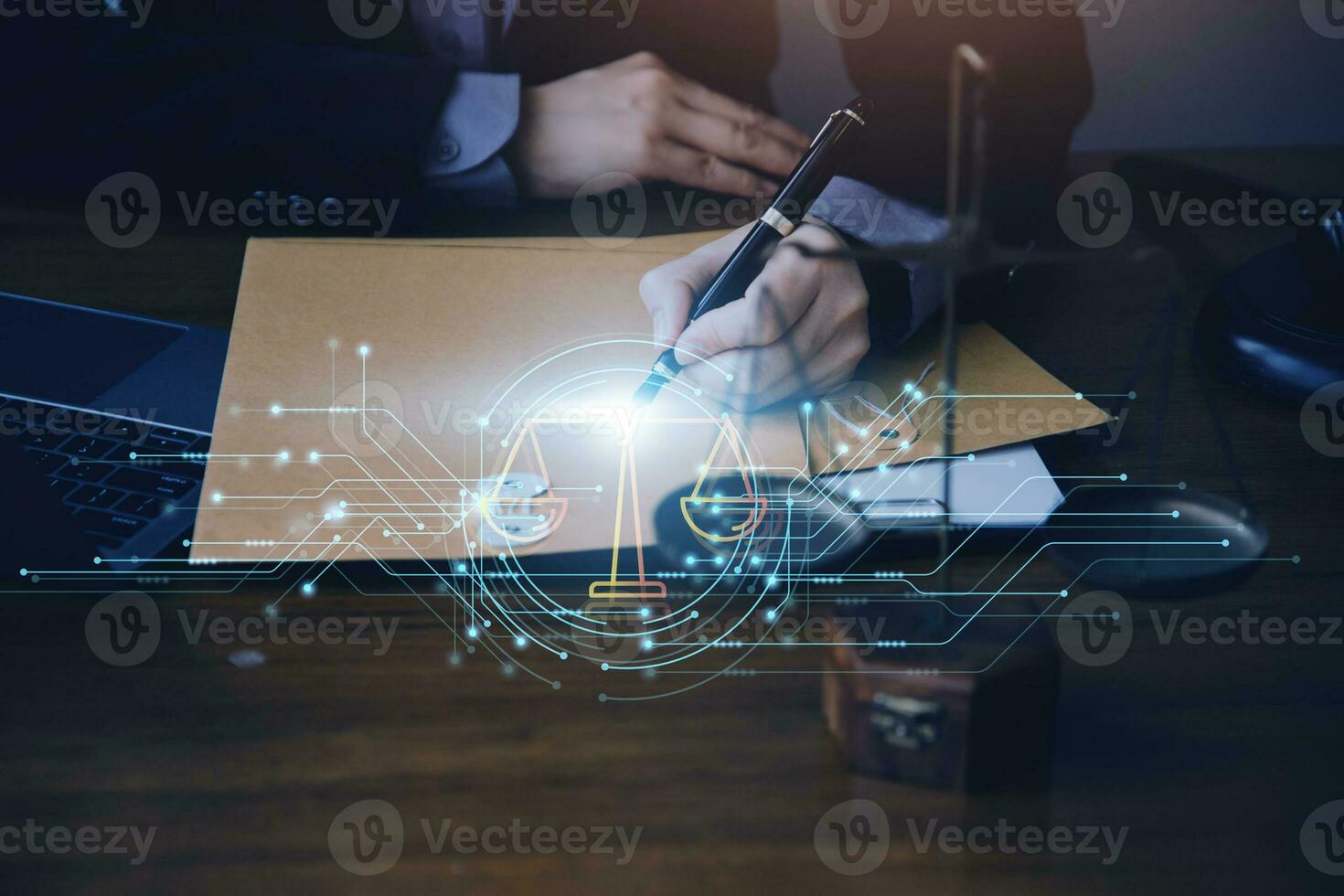 Justice and law concept.Male judge in a courtroom with the gavel, working with, computer and docking keyboard, eyeglasses, on table in morning light photo