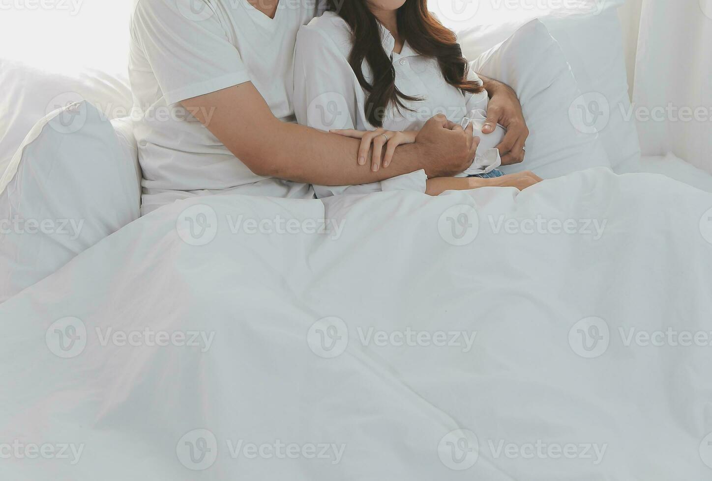 In love new couple at home.Cheerful beautiful young couple relexing on sofa home.Romantict moment.In selective focus. Setup studio shooting. photo