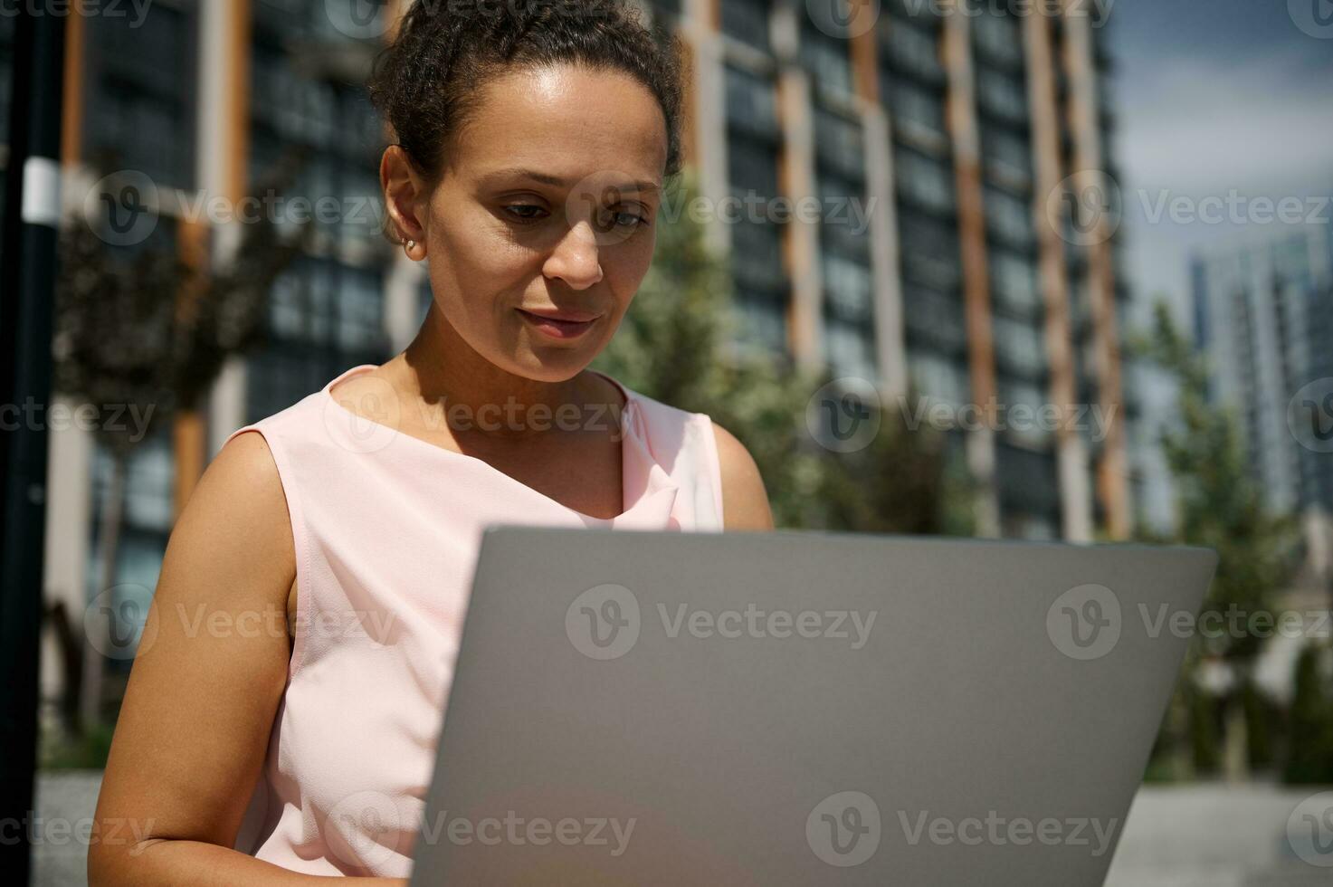 Close-up portrait of middle aged Hispanic or African American woman ...