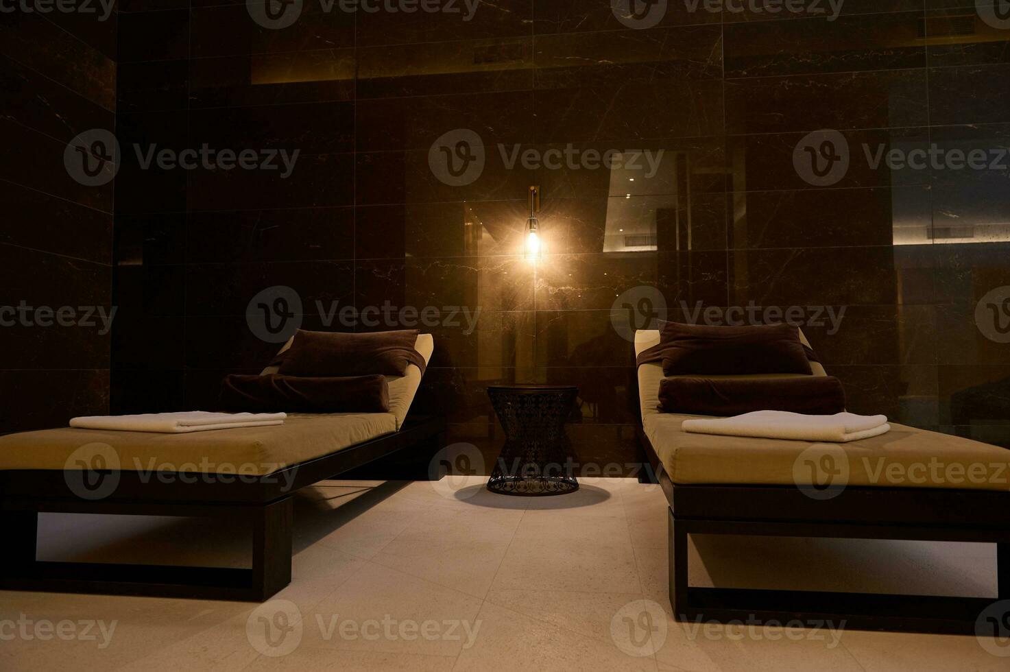 Close-up of loungers in spa room at wellness spa complex. Modern spa center interior photo