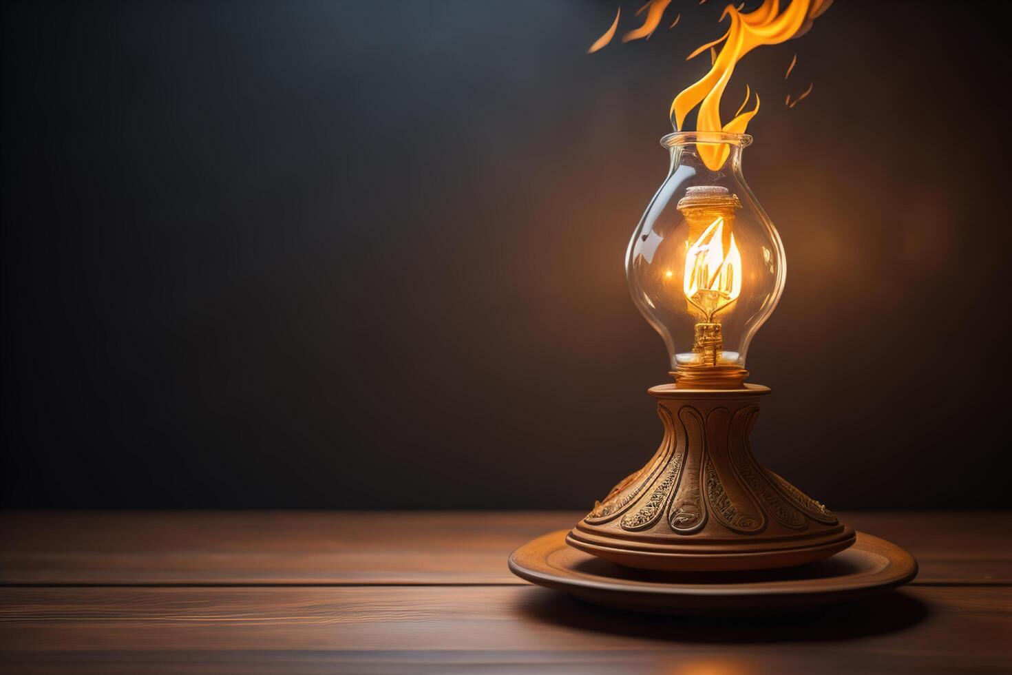 Burning kerosene lamp on a wooden table and dark background. photo