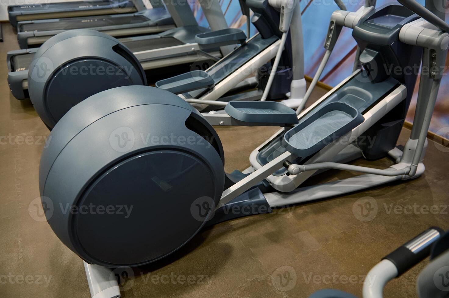 Close-up of sport equipment in fitness centre. Cardio workout concept photo