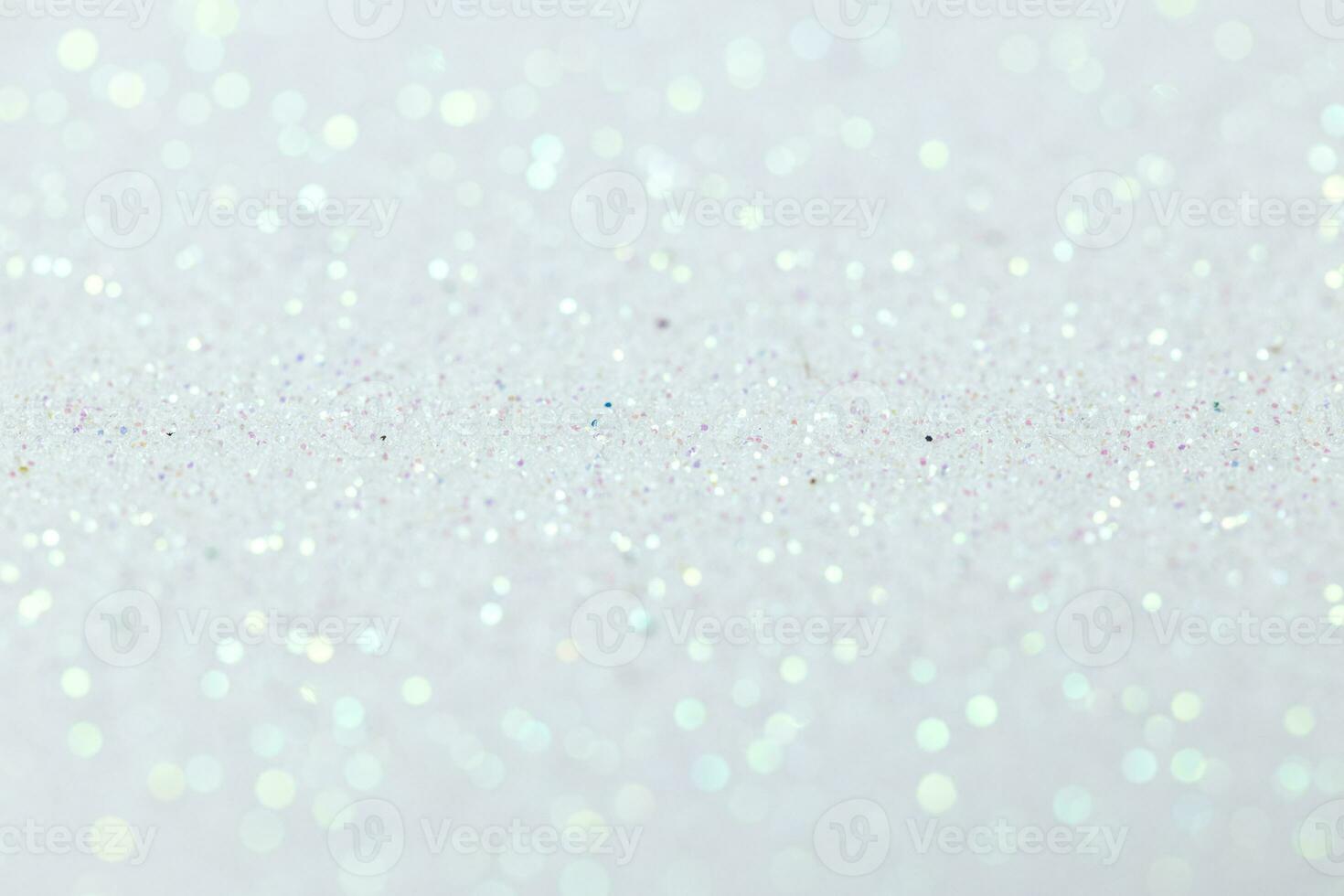 White glitter abstract background texture. Full frame. Selective focus photo