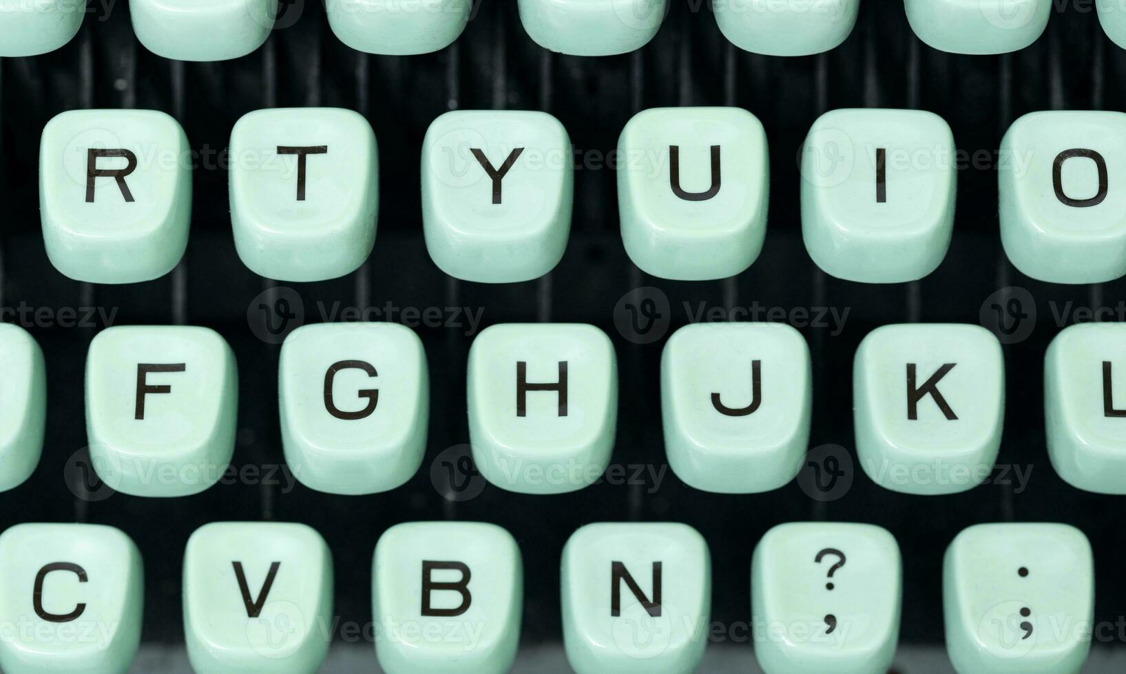 Top view of green retro typewriter keys photo