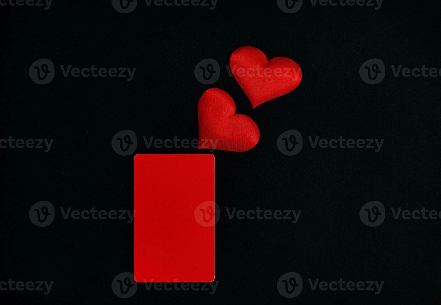 Red hearts, red vertical rectangle on a black background. Valentines day concept. Border, copy space, top view, celebration, holiday photo