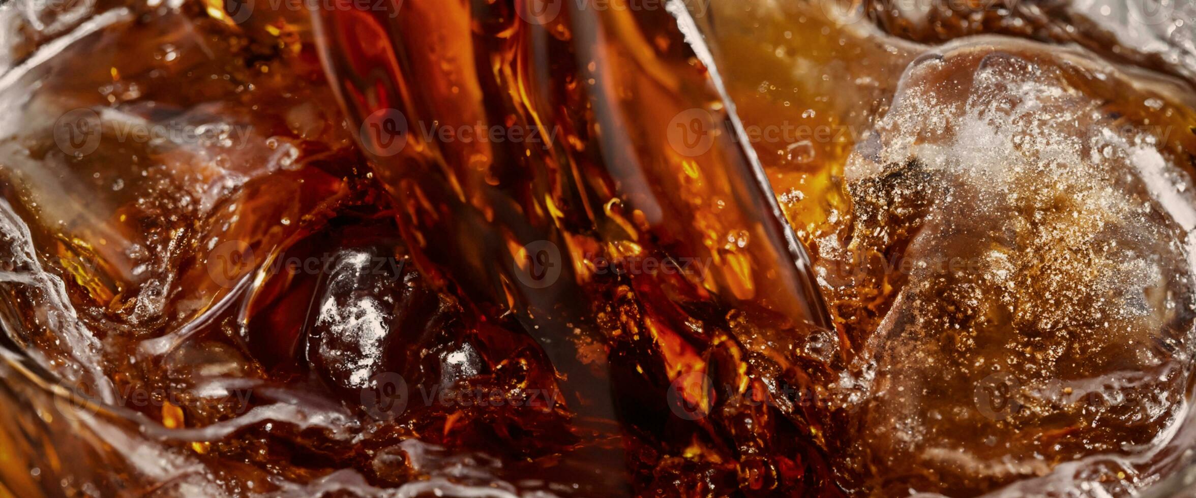 Cola soda and ice splashing fizzing or floating up to top of surface photo