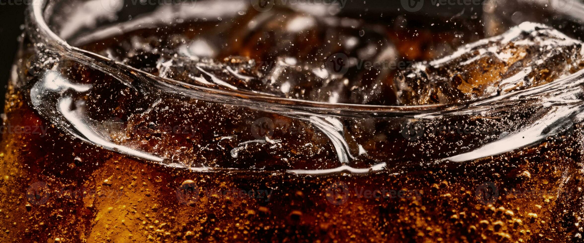 Cola soda and ice splashing fizzing or floating up to top of surface photo