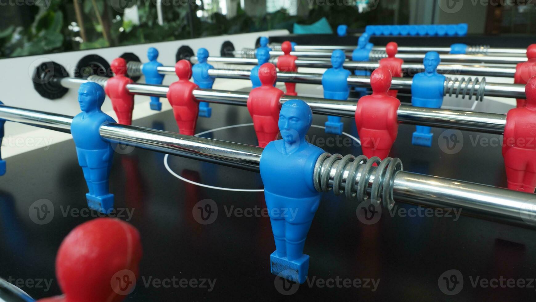 Football table or soccer table game with plastic player figurine. Mini Soccer game which famous in past and be collectable item for foosball lover. Play by two hand control each row of player figurine photo