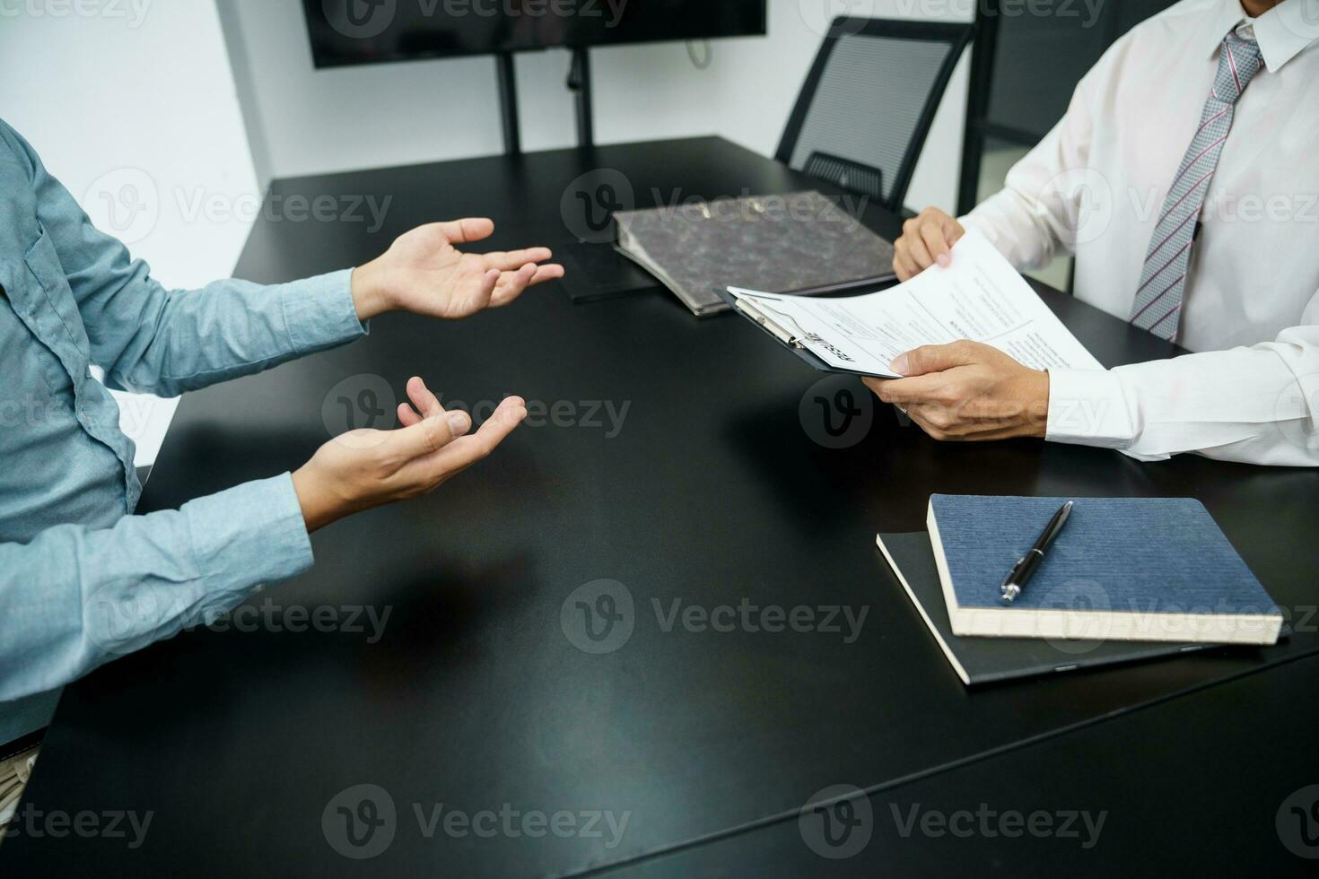 Examiner reading a resume during job interview at office Business and human resources concept. photo