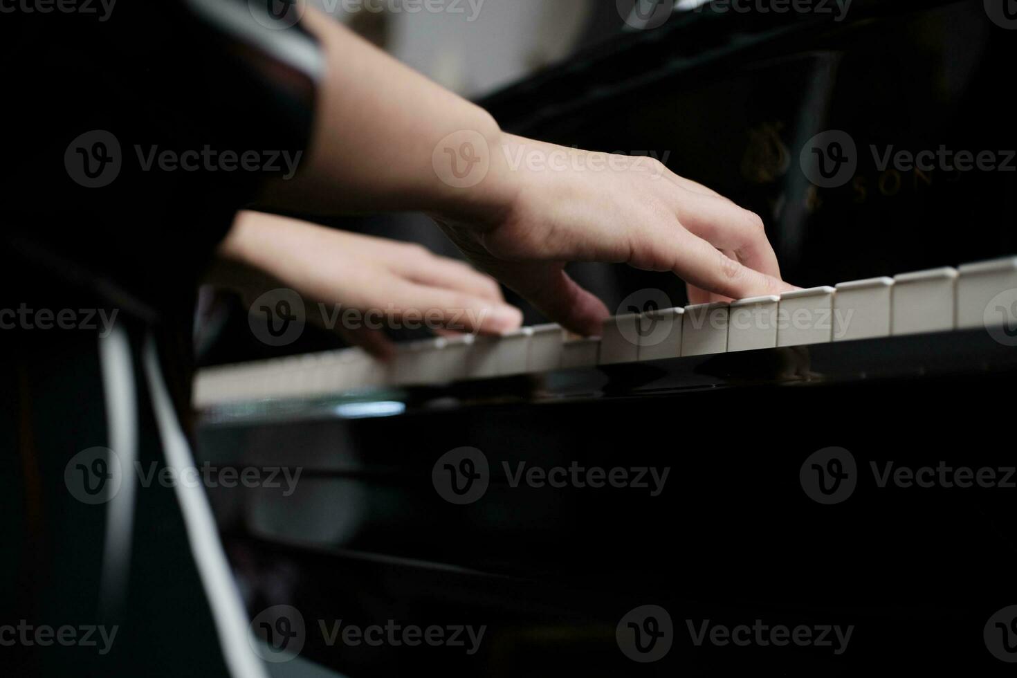 Beautiful woman playing piano, learn to play piano. photo