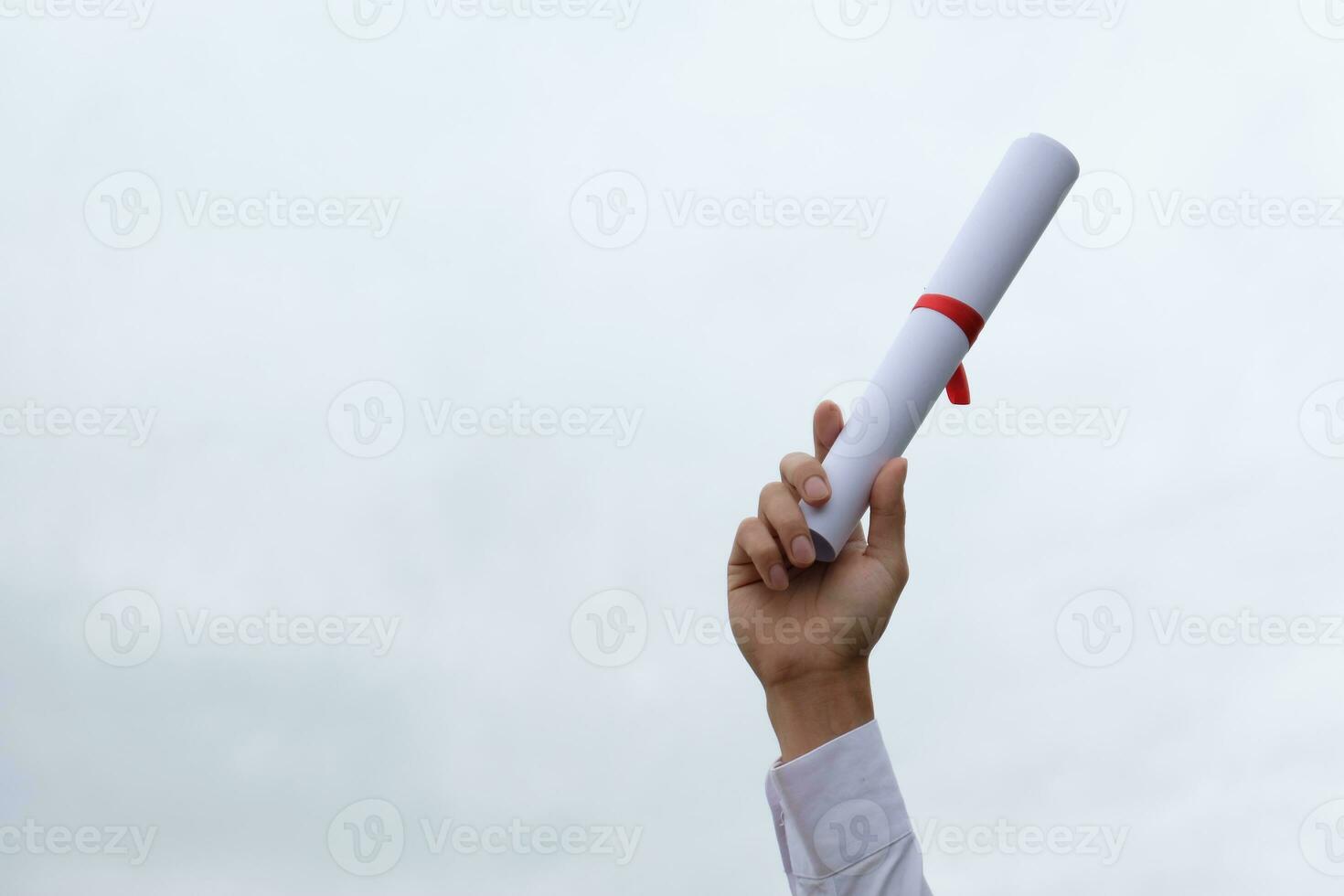 Student with congratulations, graduates wearing a graduation gown of university. photo