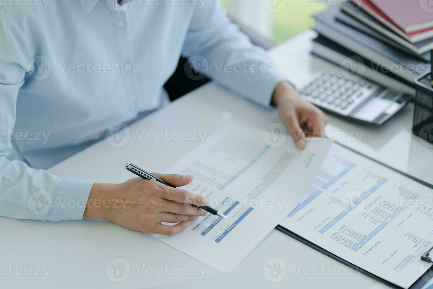 Small business accounting Businesswoman Accountant verify growing business with calculator. Accountancy photo