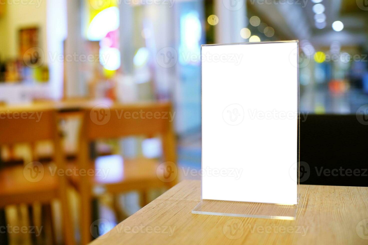 Menu frame standing on wood table in Bar restaurant cafe. space for text marketing promotion. photo