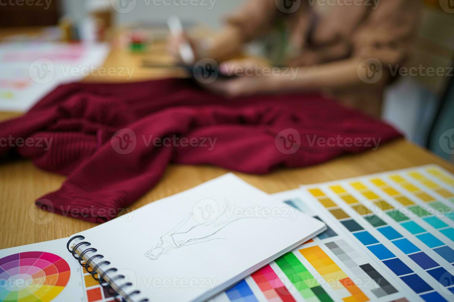 Stylish Fashion Designer work as sketch of new collection in atelier. Creative Design Concept photo